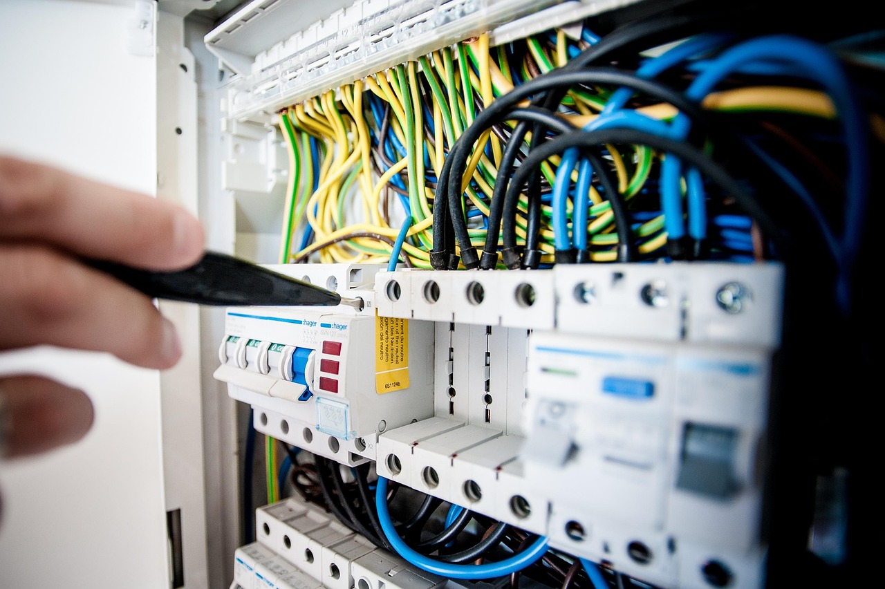 electrician working on electrical panel